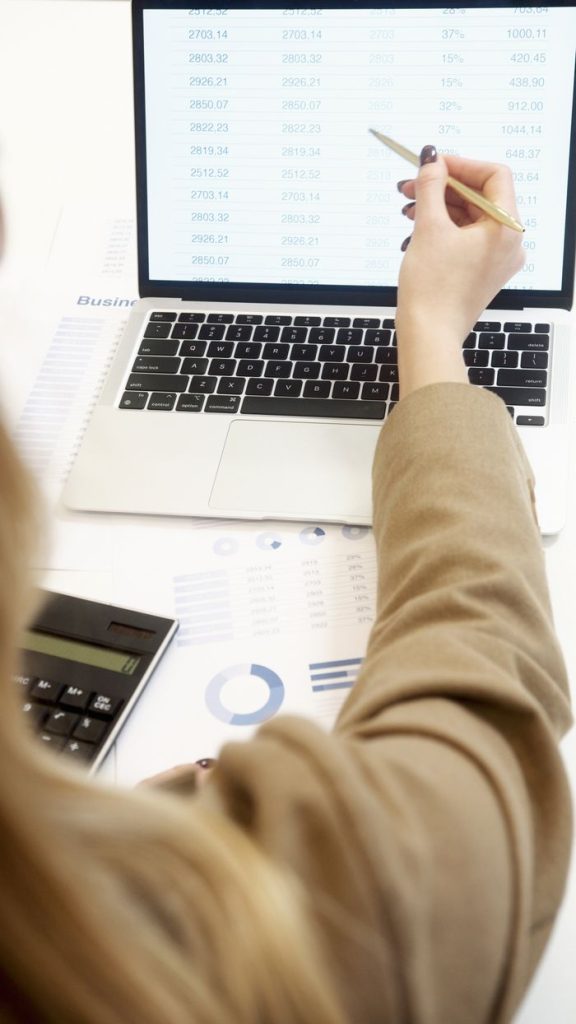 pexels photo 6779339 Business professional analyzing financial data on a laptop for strategic decision making.